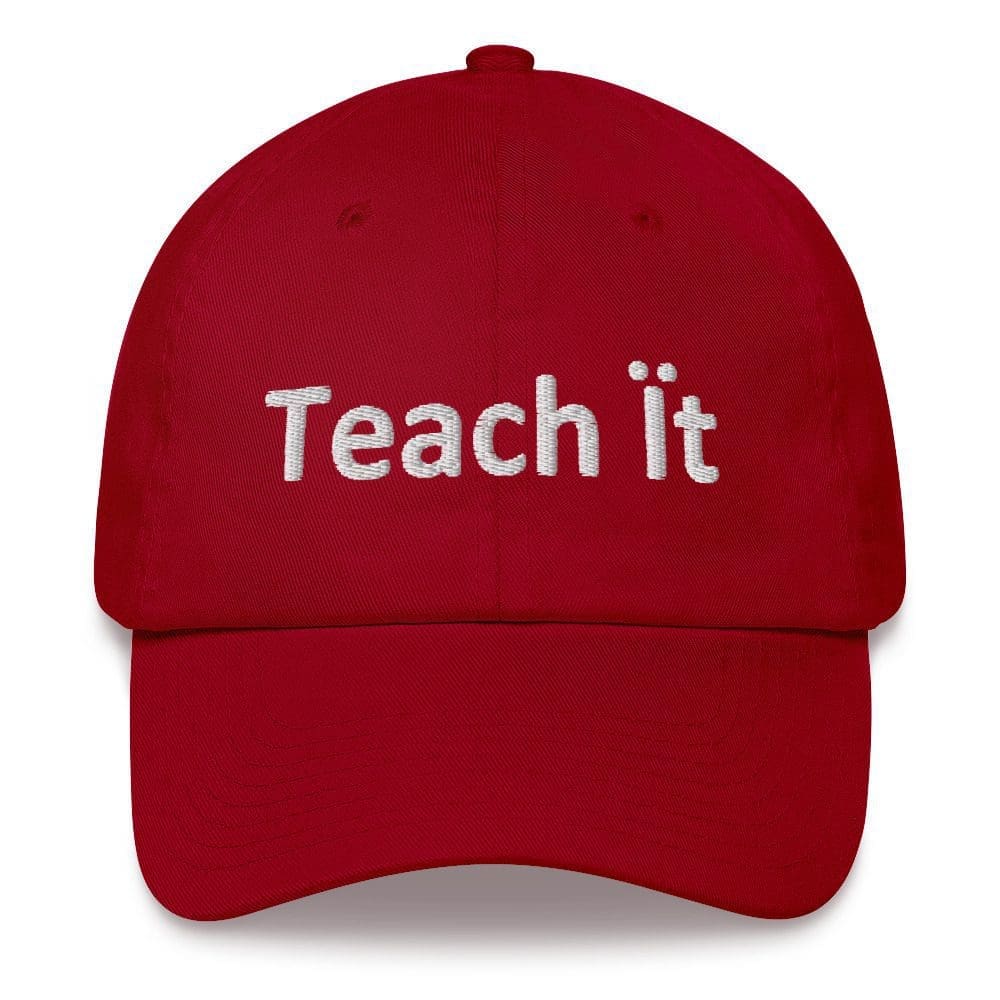 Red cap with "Teach It" text.