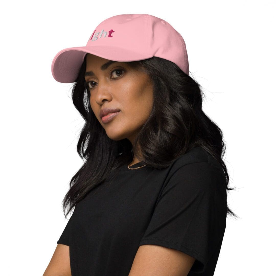 Woman wearing pink cap, black shirt.