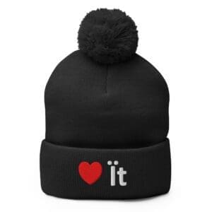 Black knit beanie with pom and red heart
