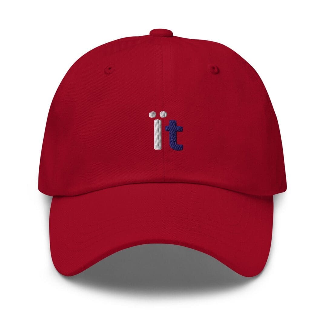 Red baseball cap embroidered with "it"